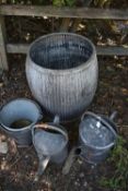 A GALVANISED DOLLY TUB, 49cm diameter x height 56cm, along with two galvanised watering cans and two