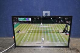 A JVC LT 32C690 32in SMART TV with wall bracket but no stand or remote, and a Zennox USB