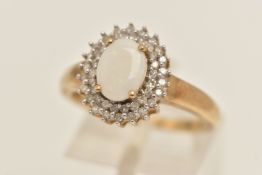 A 9CT GOLD OPAL AND DIAMOND OVAL CLUSTER RING, set with a central oval cut white opal cabochon,