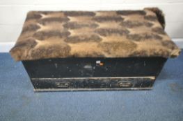 AN EBONISED PINE STORAGE CHEST, the hinged lid enclosing a candle box, metal handles to each side,