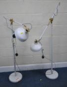 A PAIR OF WHITE FLOOR LAMPS, with adjustable shades and arms, height to mechanism 126cm, condition