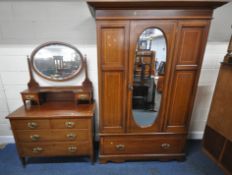AN EDWARDIAN MAHOGANY WARDROBE, with a single mirrored door, over a single drawer, width 138cm x