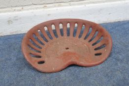 A RED PAINTED BAMLETT CAST IRON TRACTOR SEAT, width 41cm, condition report: marks, scuffs, other