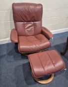 EKORNES STRESSLESS, A RED LEATHER UPHOLSTERED SWIVEL RECLINING ARMCHAIR, width 89cm x depth 80cm x