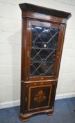 AN EDWARDIAN MAHOGANY CORNER CUPBOARD, with marquetry inlay, fitted with a single glazed door,