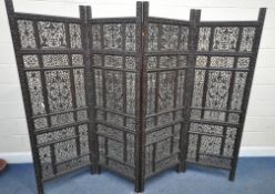 A 20TH CENTURY FOUR SECTION FOLDING SCREEN, with intricate carved foliate panels, each central panel
