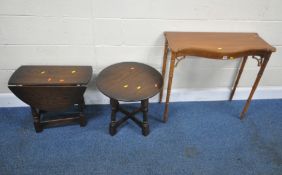 A MODERN SERPENTINE SIDE TABLE, raised on bamboo style legs, width 82cm x depth 34cm x height