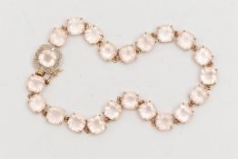 A 9CT GOLD GEM SET LINE BRACELET, twenty two cushion cut light pink rose quartz stones, four prong