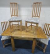 A MODERN LIGHT OAK DRAW LEAF DINING TABLE, extended length 150cm x 90cm squared x height 79cm, along