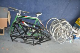 A COLLECTION OF BIKE FRAMES AND WHEELS, including a Dawes Discovery frame with seat, bars, cogs
