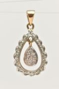A YELLOW METAL DIMAOND SET PENDANT, of an open work tear drop form, set with single cut diamonds,
