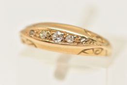 AN EARLY 20TH CENTURY YELLOW METAL BOAT RING, three single cut diamonds and two rose cut diamonds,