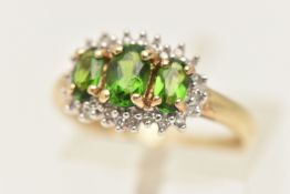 A 9CT GOLD GEM SET CLUSTER RING, set with three green stones assessed as diopside, claw set within a