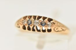 AN EARLY 20TH CENTURY YELLOW METAL BOAT RING, two circular cut sapphires and three old cut diamonds,