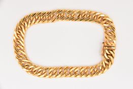 A 9CT GOLD CHAIN BRACELET, a yellow gold flat curb link bracelet, fitted with an integrated push pin