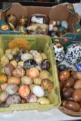 TWO BOXES AND LOOSE DECORATIVE EGGS, to include four egg shaped modern glass paperweights, wooden,