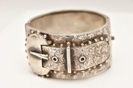 A LATE VICTORIAN SILVER BUCKLE BANGLE, wide bangle approximate width 32.2mm, foliate pattern belt