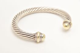 A 'DAVID YURMAN' TORQUE BANGLE BRACELET, a white metal classic cable bracelet with yellow metal