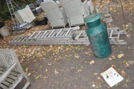 AN ALUMINIUM DOUBLE EXTENSION LADDER, a step ladder and a painted aluminium milk churn, ladder has