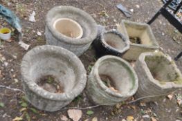 A COLLECTION OF CONCRETE PLANTERS including a boot, a pair of barrel effect etc (7). Condition