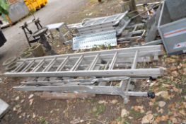 A COLLECTION OF LADDERS AND STEPS including an adapted double extension ladder, a wooden ladder