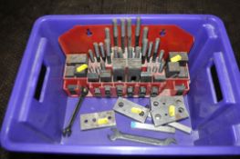 A PLASTIC BOX CONTAINING A SET OF MILLING MACHINE HOLD DOWNS