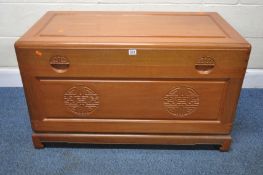 AN ORIENTAL STYLE CAMPHORWOOD BLANKET CHEST, the hinged lid enclosing a removable tray, width 103