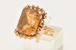 AN 18CT GOLD GEM SET RING, a large rectangular cut Citrine, prong set in yellow gold with