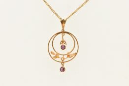 A YELLOW METAL LAVALIER PENDANT AND CHAIN, a circular form open fork pendant with two paste set