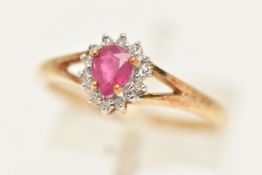 A 9CT GOLD RUBY AND DIAMOND CLUSTER RING, set with a pear cut ruby in a surround of small single cut