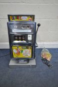 A 1960'S ARISTOCRAT OLYMPIC 1p 'CAROUSEL' ONE ARM BANDIT, along with a bag of pennies, width 41cm