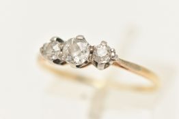 A YELLOW METAL THREE STONE DIAMOND RING, set with three old cut diamonds, in claw settings,