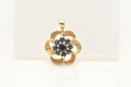 A 9CT GOLD PENDANT, a sapphire floral cluster pendant in yellow gold, hallmarked 9ct, approximate