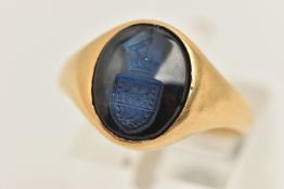 AN 18CT GOLD SYNTHETIC SAPPHIRE SIGNET RING, an oval cut sapphire intaglio seal, collet set in