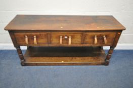 A GEORGIAN OAK SIDE TABLE, with three frieze drawers, later leather strap handles, raised on