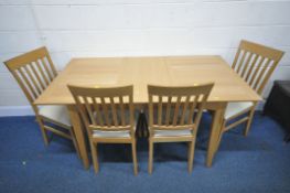 A MODERN OAK EXTENDING DINING TABLE, with a single fold out leaf, raised on tapered legs, extended
