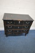 AN EBONISED CHINESE BREAKFRONT CHEST OF THREE LONG DRAWERS, raised on cabriole legs, width 98cm x