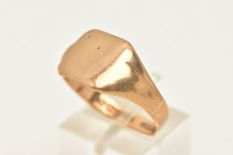 A 9CT GOLD SIGNET RING, a square form yellow gold signet ring, shank distorted, hallmarked