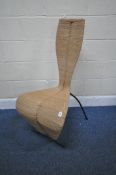 AFTER TOM DIXON, A RATTAN S CHAIR, with splayed metal legs, width 51cm x depth 64cm x height