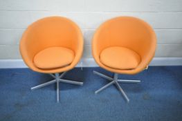 A PAIR OF ORANGE UPHOLSTERED IKEA SKRUVSTA SWIVEL CHAIRS, condition report: in need of a clean,