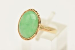 A 14CT GOLD GEM SET RING, an oval cabochon jade stone, collet set in yellow gold, hallmarked 14ct