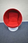 IN THE MANNER OF EERO AARINO, A WHITE BALL CHAIR, with red upholstery, entrance diameter 100cm x