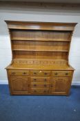 A GOOD QUALITY REPRODUCTION GEORGIAN STYLE OAK DRESSER, the three tier plate rack with eight small
