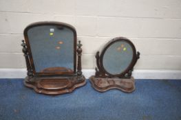 TWO VICTORIAN MAHOGANY DRESSING TABLE MIRRORS, the largest mirror with an arched top, raised on