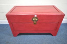 A RED PAINTED CAMPHORWOOD BLANKET CHEST, the hinged lid enclosing a removable tray, width 102cm x