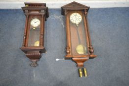 A 20TH CENTURY VIENNA WALL CLOCK, the glass door enclosing an eight inch brass and enamel dial,