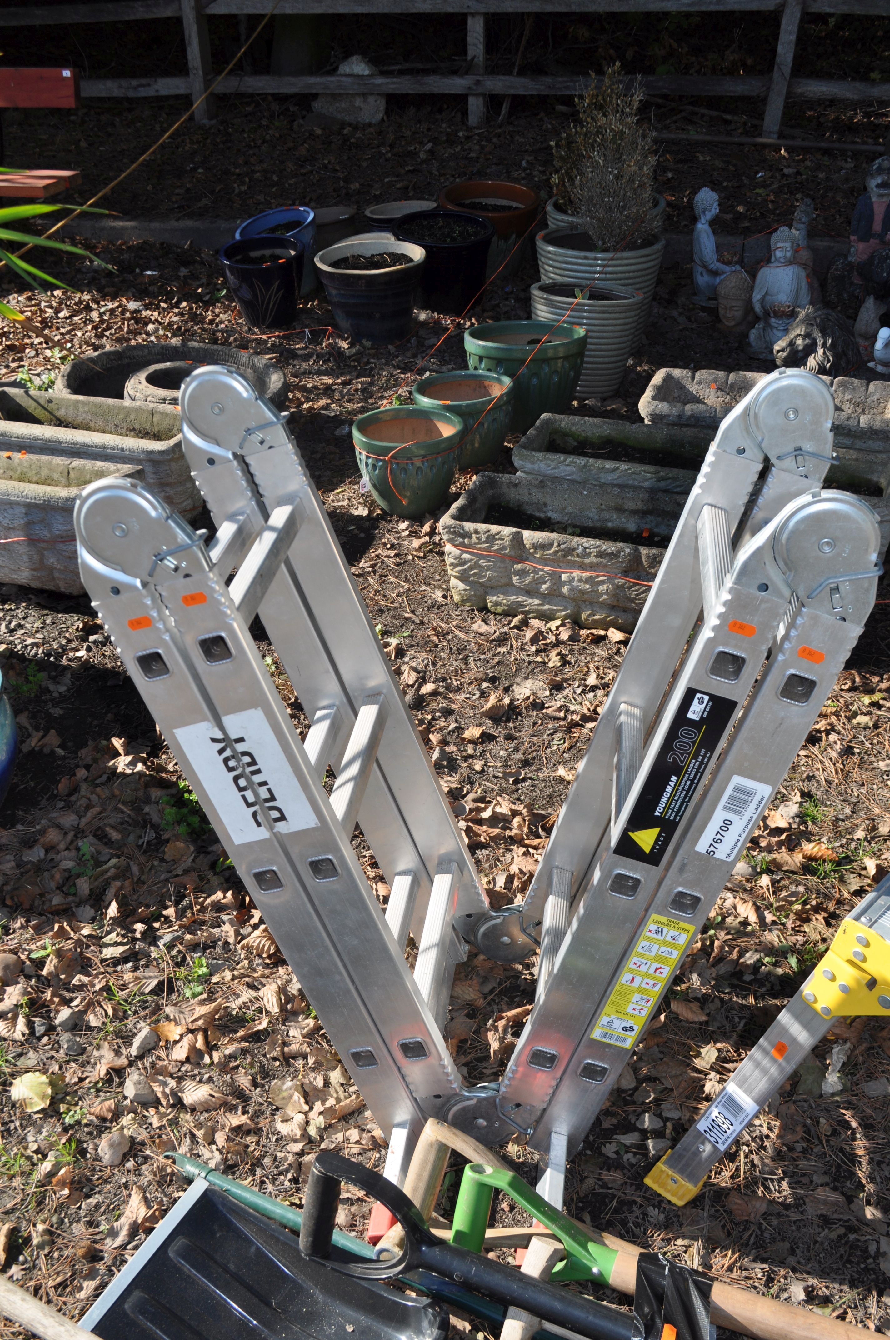 Step Rake Metal A COLLECTION OF GARDEN TOOLS, including a Youngman platform ladder, a ...