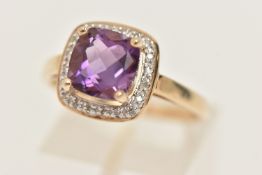 A 9CT GOLD GEM SET RING, designed as a faceted square cut amethyst, set with a surround of single