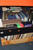 FOUR BOXES OF BOOKS containing a large number of miscellaneous titles, mostly in hardback format,