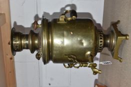 A RUSSIAN BRASS SAMOVAR, of covered cylindrical form on a pedestal base, with twin wooden handles,